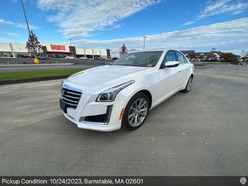 White Cadillac CTS sedan prepared for auto transport pickup in Barnstable, MA, handled by Auto Transport Professionals.