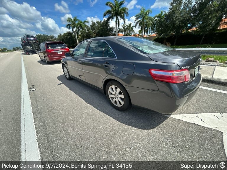 Toyota Camry and red minivan being transported on the highway in Bonita Springs, FL 34135 by Auto Transport Professionals.