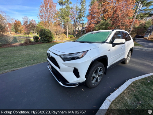 White Toyota RAV4 ready for auto transport pickup in Raynham, MA, handled by Auto Transport Professionals.