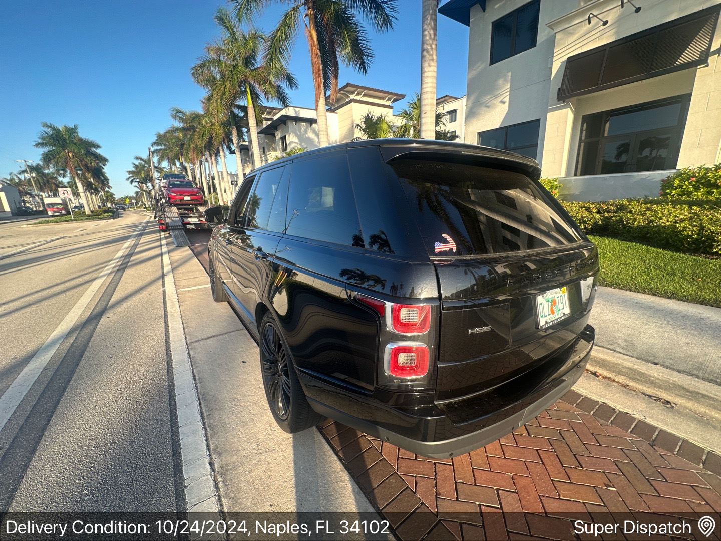 Car on open carrier - Auto Transport Professionals